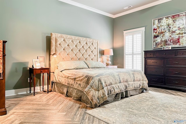 bedroom featuring baseboards, crown molding, and visible vents