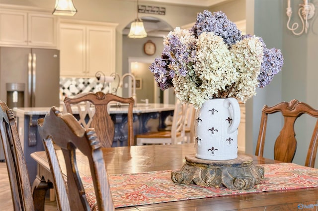 dining area with arched walkways