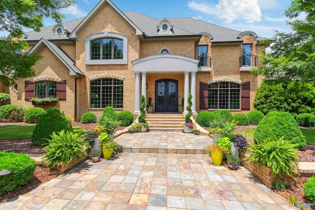 french provincial home with french doors