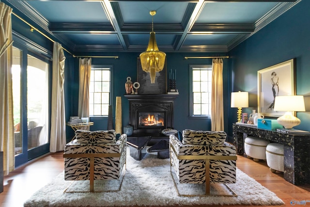 living area with beamed ceiling, hardwood / wood-style floors, crown molding, and coffered ceiling