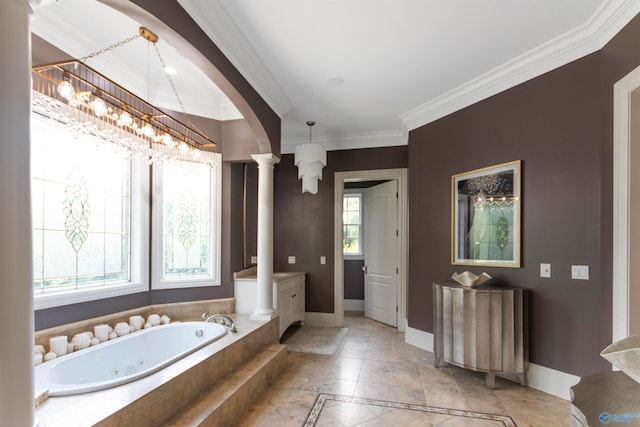 bathroom featuring a wealth of natural light, ornamental molding, ornate columns, and a relaxing tiled tub