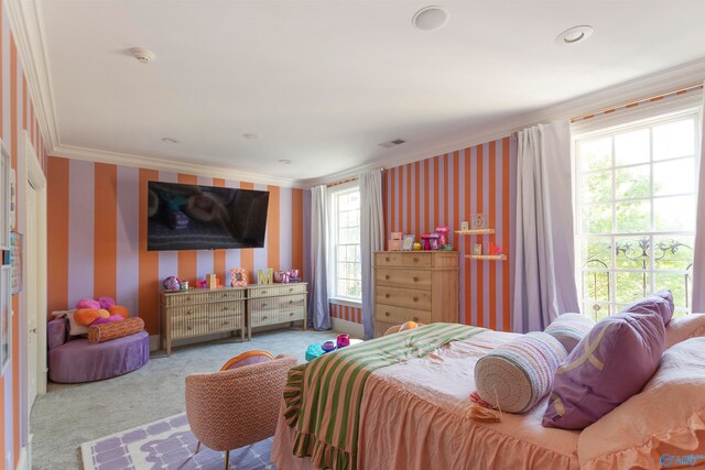 carpeted bedroom featuring ornamental molding and multiple windows