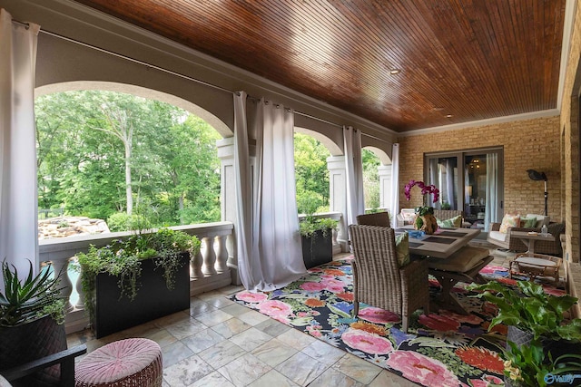 sunroom / solarium featuring wooden ceiling