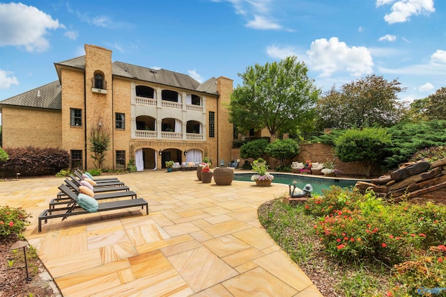 view of patio / terrace with a balcony