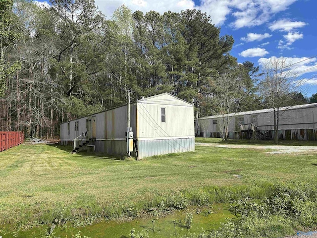 view of outdoor structure featuring fence