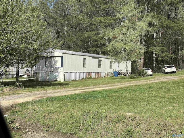 view of home's exterior featuring a lawn