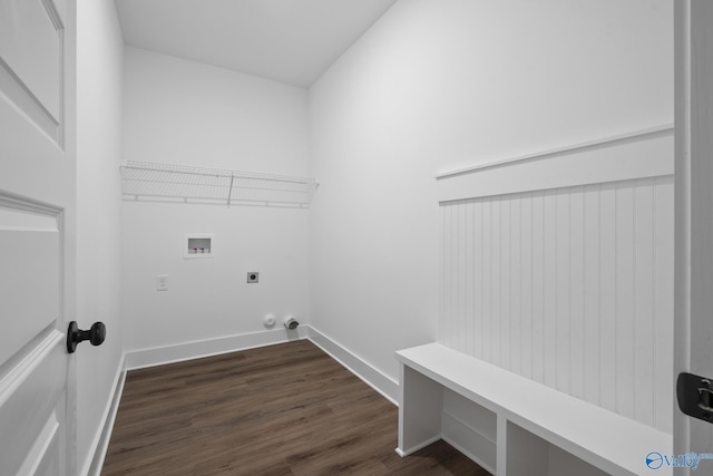 laundry area with electric dryer hookup, hookup for a washing machine, and dark hardwood / wood-style floors