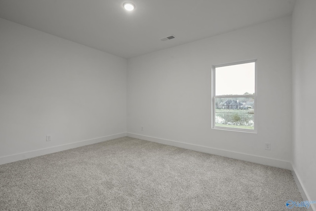 unfurnished room featuring carpet