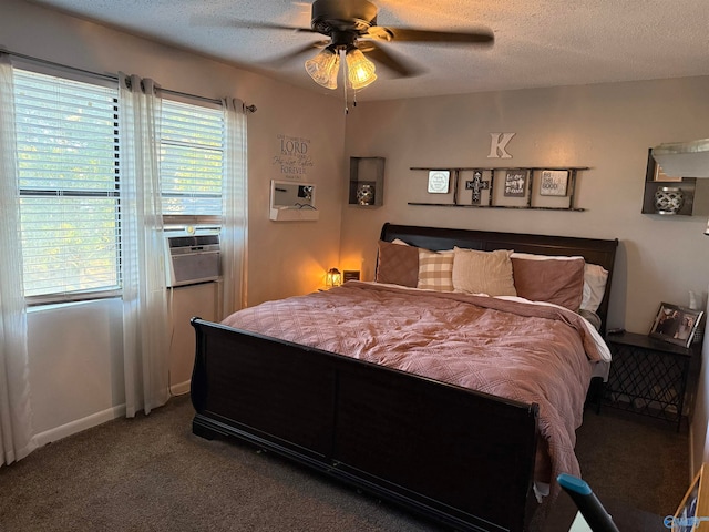 carpeted bedroom featuring multiple windows, a textured ceiling, and ceiling fan