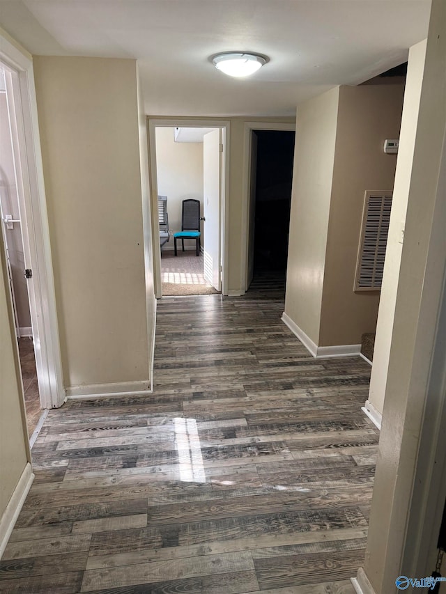 hall featuring dark wood-type flooring