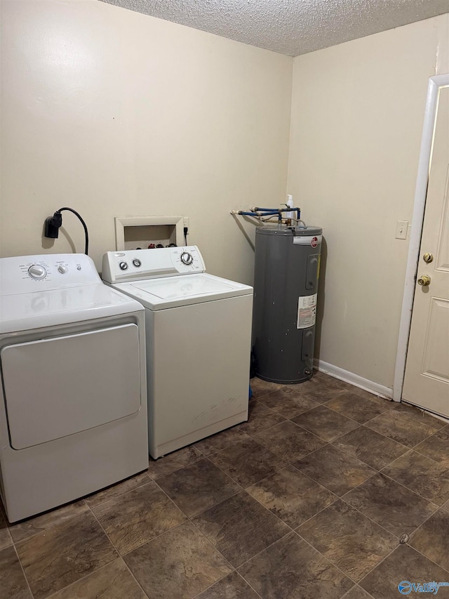 laundry area featuring washer and dryer, electric water heater, and a textured ceiling