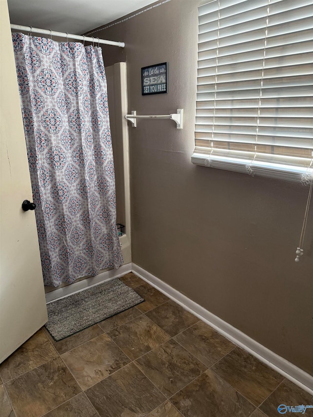 bathroom with curtained shower