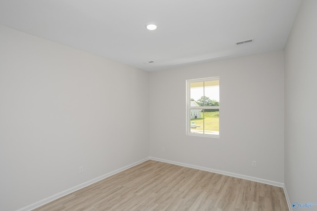 unfurnished room with light hardwood / wood-style flooring