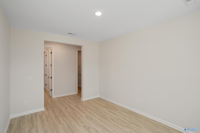 empty room with light hardwood / wood-style floors