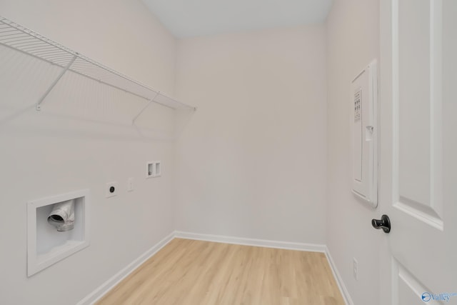 clothes washing area with washer hookup, wood-type flooring, and electric dryer hookup