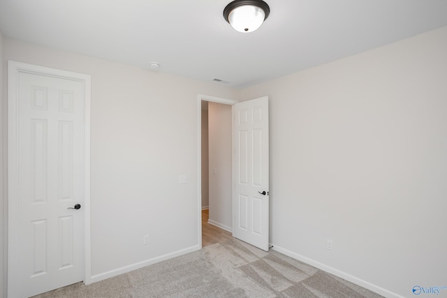 interior space with light colored carpet