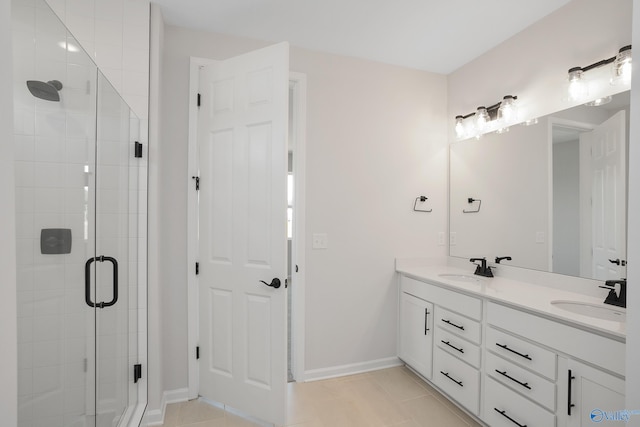 bathroom featuring vanity, tile patterned floors, and walk in shower