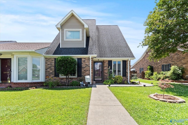 2413 Remington Cir SW, Decatur, AL 35601 - view of front facade with a front yard, brick siding, and a shingled roof