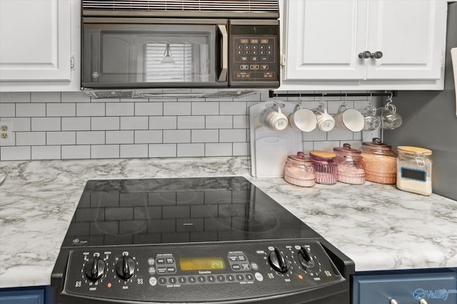 2413 Remington Cir SW, Decatur, AL 35601 - kitchen view of range, backsplash, and white cabinets