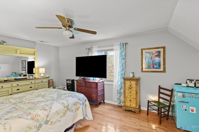 2413 Remington Cir SW, Decatur, AL 35601 - bedroom featuring light wood-style floors, lofted ceiling, and a ceiling fan