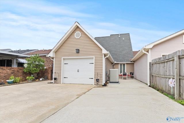 2413 Remington Cir SW, Decatur, AL 35601 - view of front of home featuring concrete driveway, a garage, and roof with shingles
