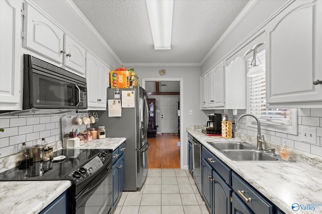 2413 Remington Cir SW, Decatur, AL 35601 - kitchen featuring black appliances, blue cabinets, white cabinetry, a textured ceiling, and crown molding