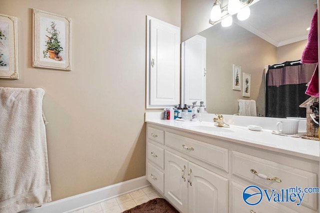 bathroom featuring vanity, ornamental molding, and tile patterned floors