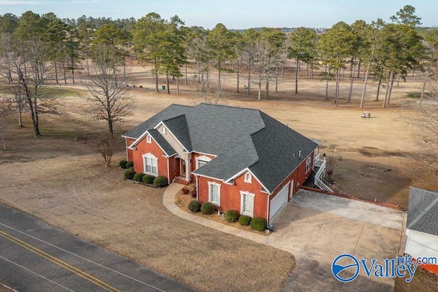 birds eye view of property with a rural view