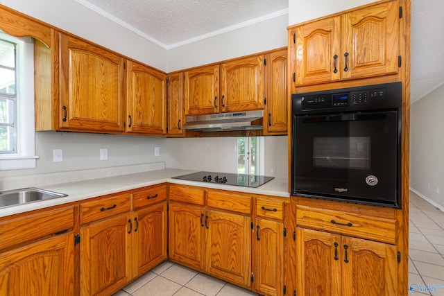 kitchen with crown molding, light tile patterned floors, a textured ceiling, and black appliances