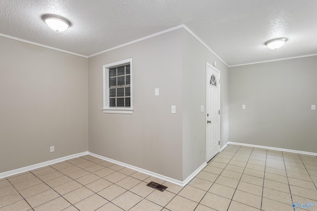 hall with light tile patterned flooring, ornamental molding, and a textured ceiling