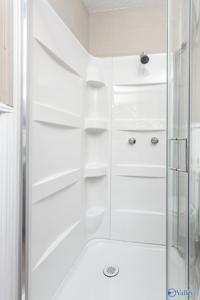 bathroom featuring walk in shower