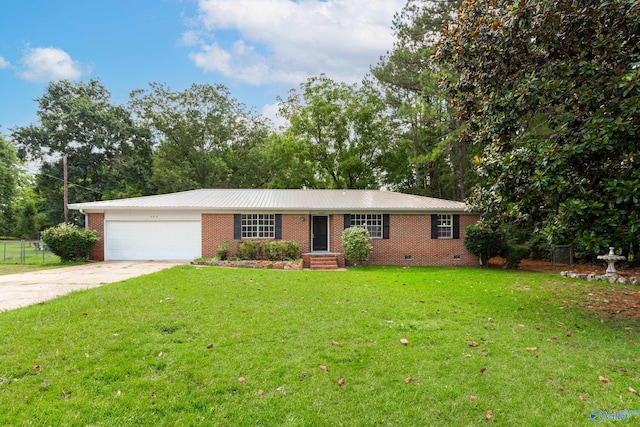 single story home with a garage and a front lawn