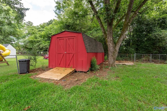 view of outbuilding with a lawn