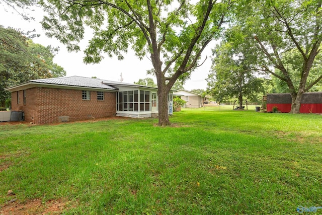 view of yard with a sunroom