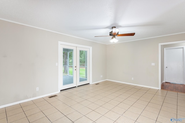 spare room with light tile patterned flooring, crown molding, french doors, and ceiling fan