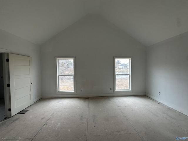 spare room with high vaulted ceiling and a wealth of natural light