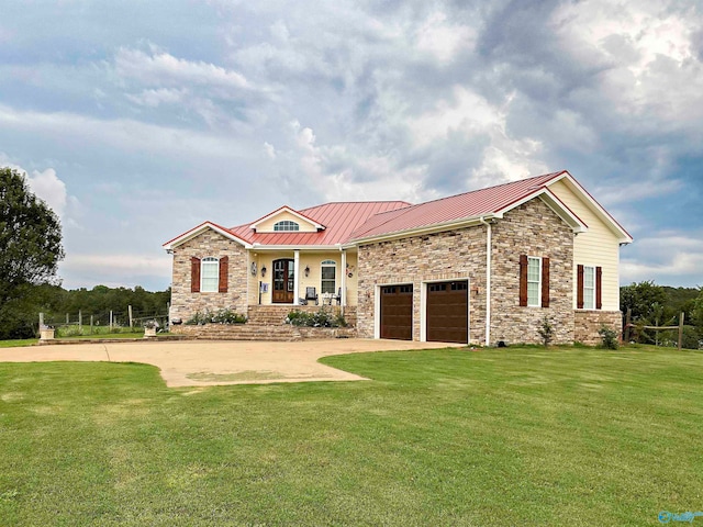 view of front of property with a garage, a front yard, and covered porch