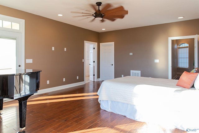 bedroom featuring ceiling fan and dark hardwood / wood-style flooring