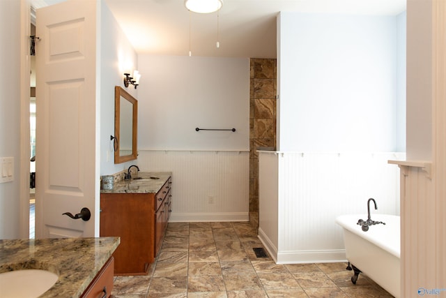 bathroom featuring vanity and a bathtub