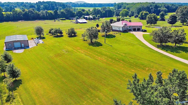 birds eye view of property with a rural view