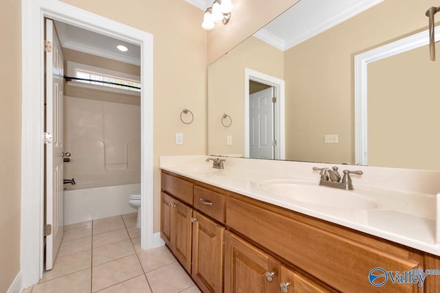 bathroom featuring tile patterned floors, ornamental molding, toilet, and a sink