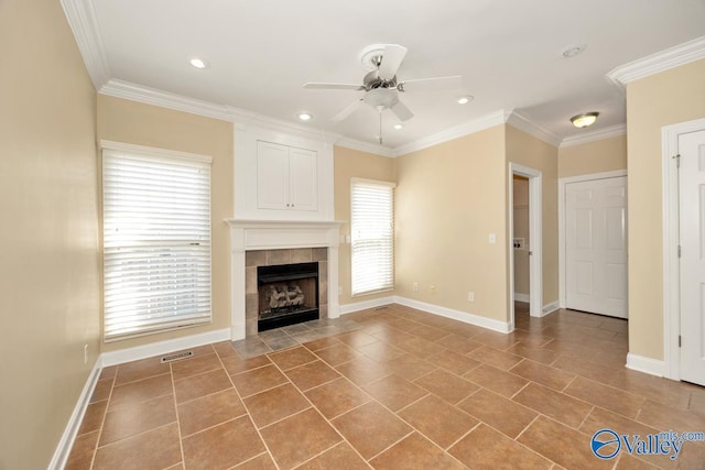 unfurnished living room with a tiled fireplace, visible vents, and ornamental molding