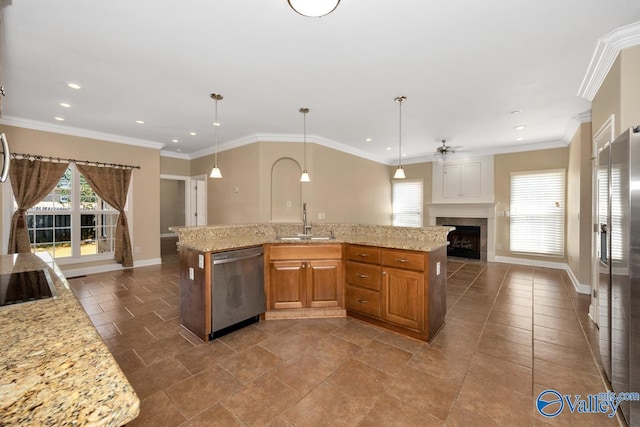 kitchen with open floor plan, a healthy amount of sunlight, a sink, and stainless steel dishwasher