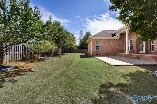 view of yard with a patio area and a fenced backyard