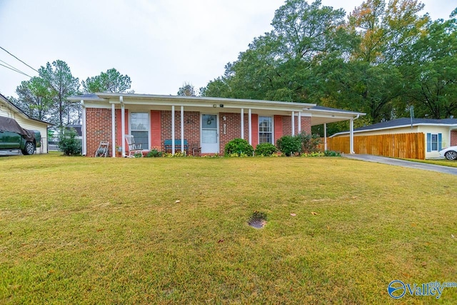 single story home featuring a carport and a front lawn