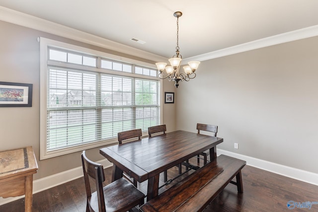 dining space with ornamental molding, visible vents, wood finished floors, baseboards, and a notable chandelier