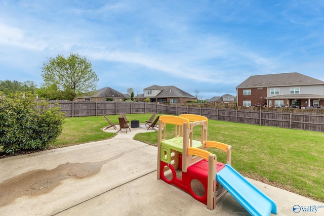 view of patio / terrace with a fenced backyard and a residential view
