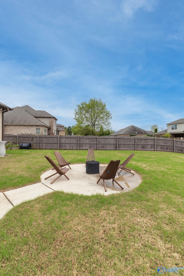 view of yard with a patio area and a fenced backyard