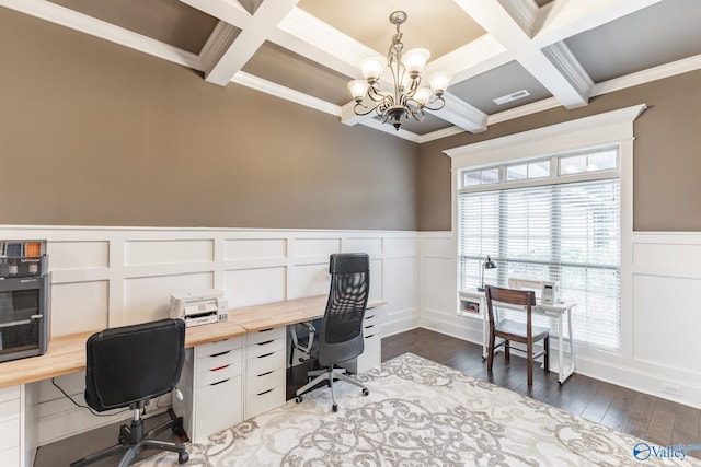 office featuring a decorative wall, an inviting chandelier, crown molding, and coffered ceiling