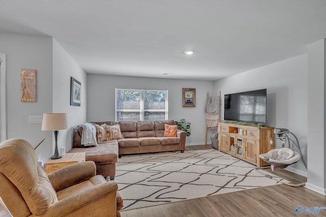 living room with light hardwood / wood-style flooring